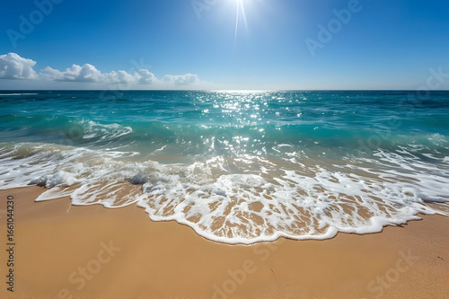 A coastline where turquoise ocean waves gently meet golden sandy beaches, to emphasize travel, relaxation, and the serene beauty of nature