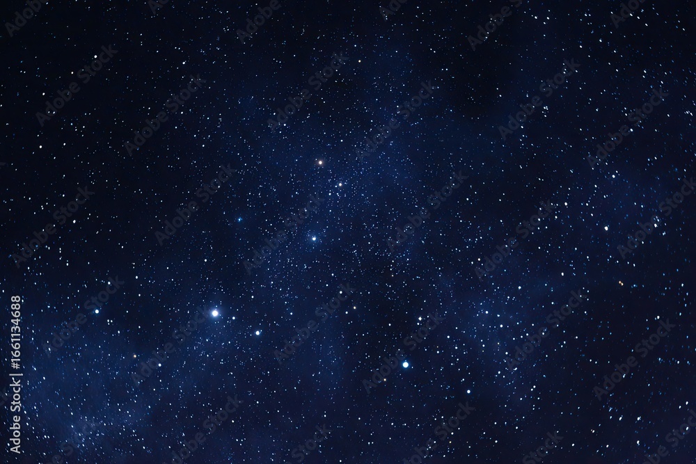 Fototapeta premium Deep night sky, densely speckled with stars, a few clusters of brighter stars