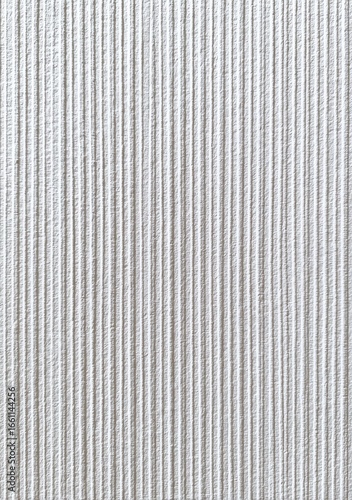 Close-up view of vertical ribbed white surface
