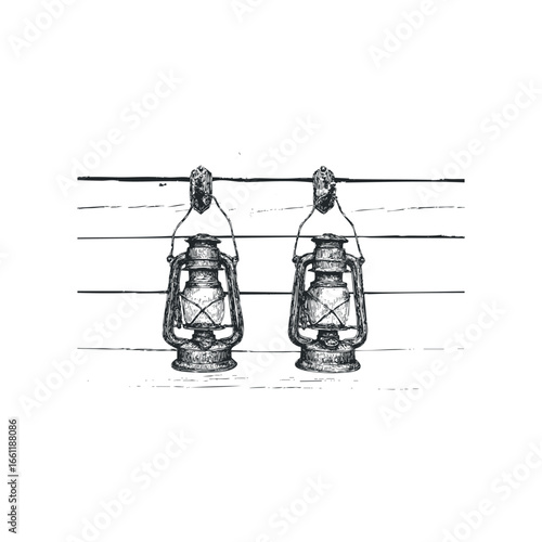 Two kerosene lanterns hanging on a wooden wall