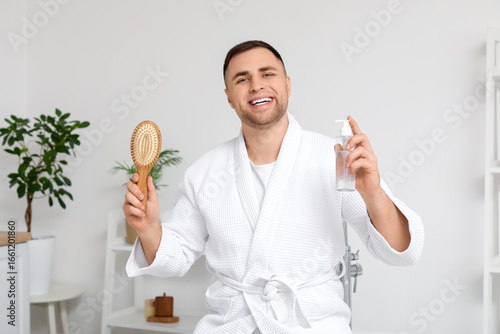 Young man with cosmetic pro...