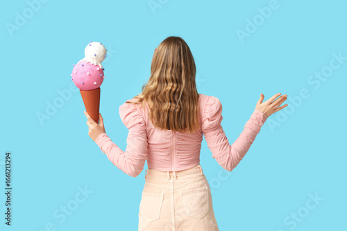 Young woman holding toy ice...