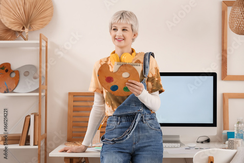 Young woman in headphones h...