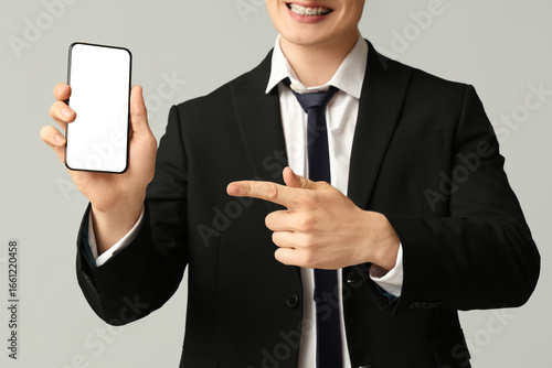 Young businessman pointing ...