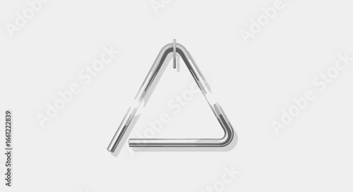 Shiny metal triangle percussion instrument on a clean light background