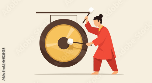 The gong ringer performs musical rhythm in a traditional presentation