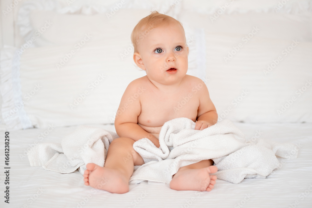 baby after bathing in a towel, baby hygiene, baby in a bath towel baby after bathing in a towel, baby hygiene, baby in a bath towel
