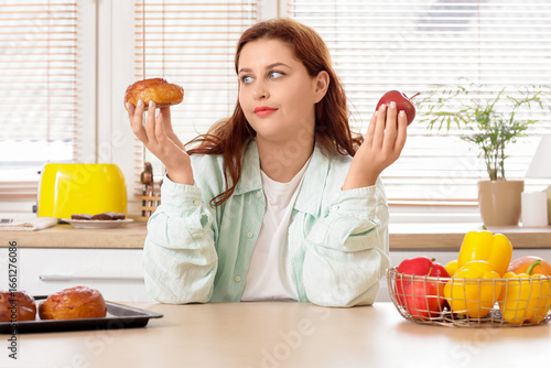 Overweight young woman choo...