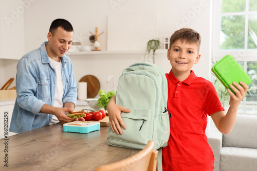 Little boy with school lunc...