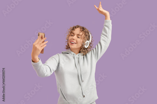 Young woman in headphones w...