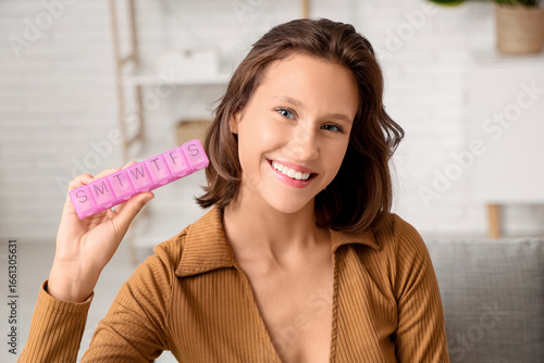 Pretty young woman with pil...