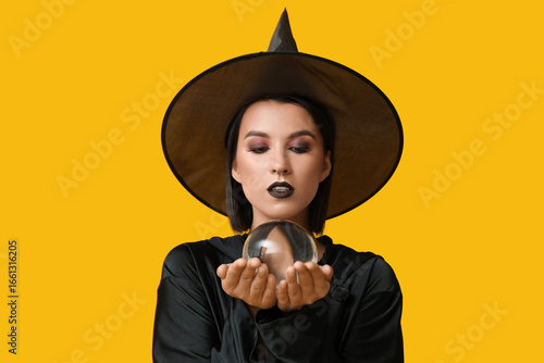 Beautiful young witch with ...
