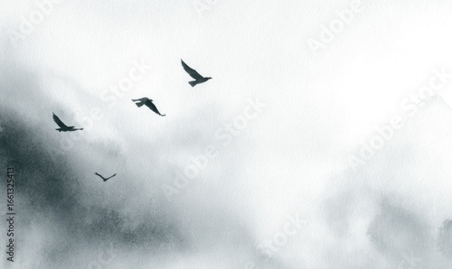 Three birds soar through a misty, gray landscape