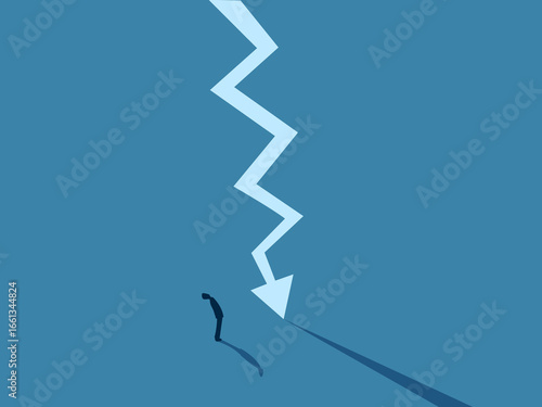 Businessman Stands Looking at a Crisis Graph