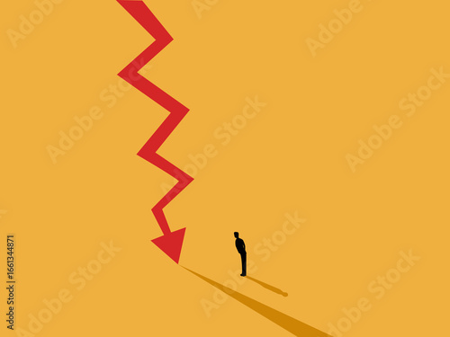 businessman stands looking at the crisis line