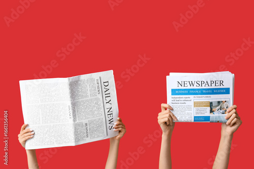 Female hands with newspaper...