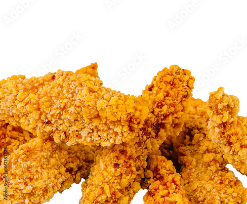 Crispy fried chicken tenders stacked on a white background