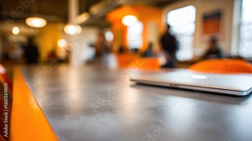 Wallpaper Mural Medium shot of a shared office desk with germresistant coating a laptop partially in focus while nearby surfaces remain softly blurred for emphasis. Torontodigital.ca