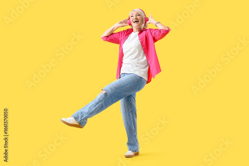 Mature woman in headphones ...