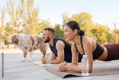 Sporty young couple with Au...