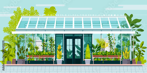 Modern glass greenhouse facade with a white frame, filled with lush tropical plants and foliage.
