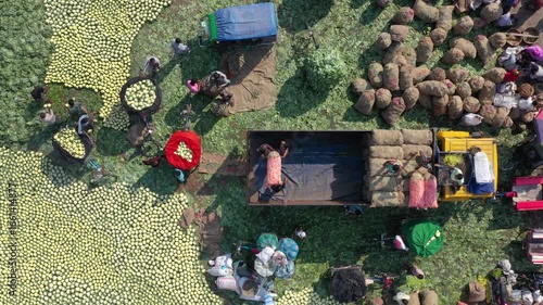 Bogura, Bangladesh - 18 August 2025: Aerial view of the vegetable market bustling with activity, featuring vibrant produce and busy vendors.