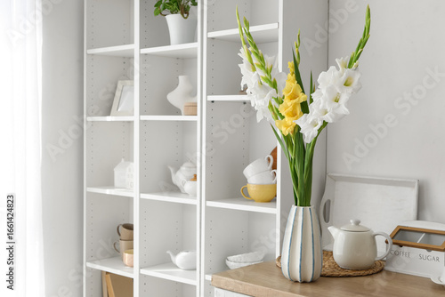 Vase with gladiolus flowers...