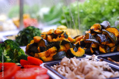 Grilled Japanese pumpkin, small pieces on a tray, buffet bar