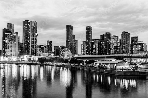 Melbourne, Victoria, Australia - 19 April 2025 : South Wharf Promenade at twilight on the banks of the river Yarra in black and white