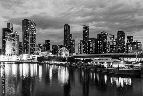 Melbourne, Victoria, Australia - 19 April 2025 : South Wharf Promenade at twilight on the banks of the river Yarra in black and white