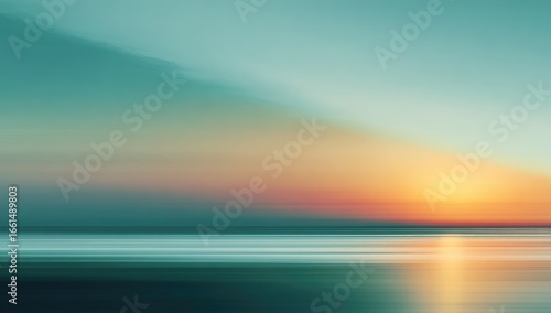 Blurry sunset over water.  Soft, colorful, abstract, and tranquil.  Long exposure creates motion blur of clouds and water.  Muted, pastel colors dominate