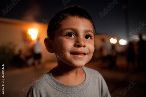 father sets off fireworks in backyard amidst joyful cheers of children nearby