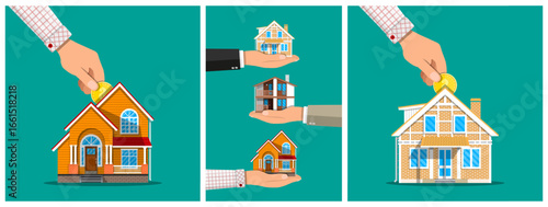 Man puts coin into home building as investment. Hand holds various house models showing ownership concept. Real estate agent selling cottage for a new home.
