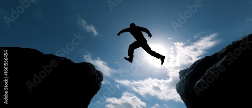 The daring jump of a silhouette against a bright sky.