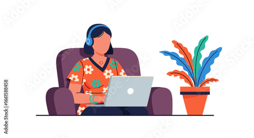 Woman in headphones working comfortably on her laptop from home, embodying remote work, online learning, or digital lifestyle flexibility.