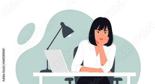 Bored businesswoman looking unmotivated at her desk with a laptop. Illustrates burnout, work stress, or lack of engagement in the office.