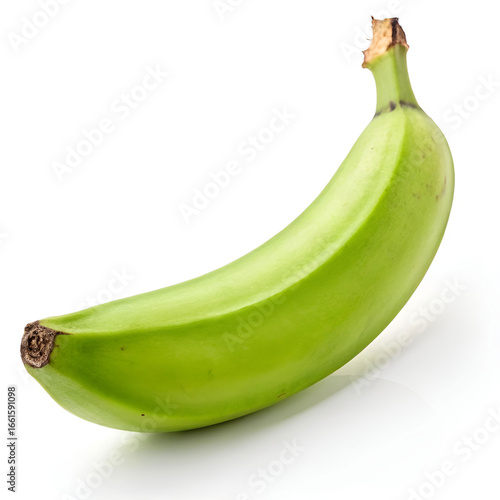 A fresh green banana, unripe and firm, isolated on a white background.