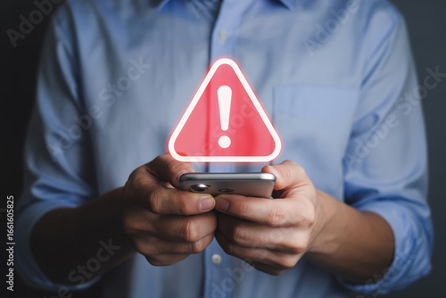Navigating Digital Dangers A Man's Encounter with a Warning Alert on His Smartphone Signifying Low Feedback and Potential Security Risks