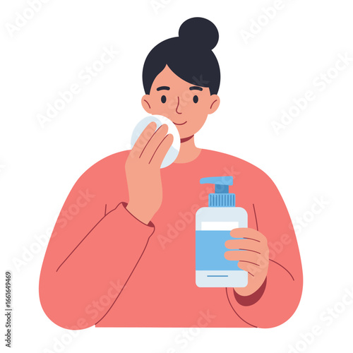 A cheerful young woman with a neat bun gently applies refreshing facial toner using a soft cotton pad, embracing her daily beauty ritual for healthy skin.