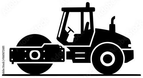 Road roller moving slowly and crushing rocks on construction site with big wheels