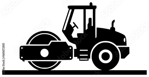 Road roller moving slowly and crushing rocks on construction site with big wheels