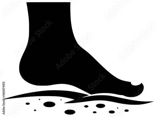 Human toe in morning light and warm water with delicate rings on sandy beach