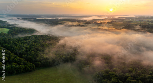 sunset in the foggy mountains