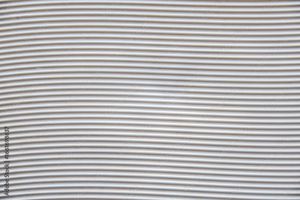 Obraz premium White plastic base with grooves forming horizontal waves