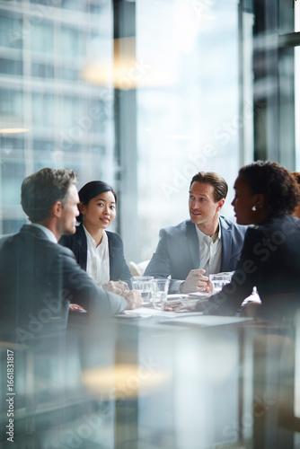 Business men and women wearing suit or formal outfit, discussing at their meeting with co-worker and client at   modern office in urban building. 