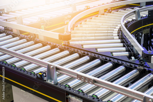 The machinery system for delivering goods in the material warehouse with a sliding mechanism, in a focus view on the sliding equipment.