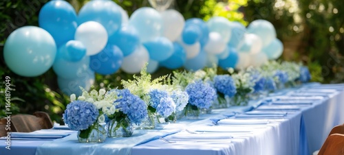 The elegant blue flower arrangements on a beautifully set outdoor table