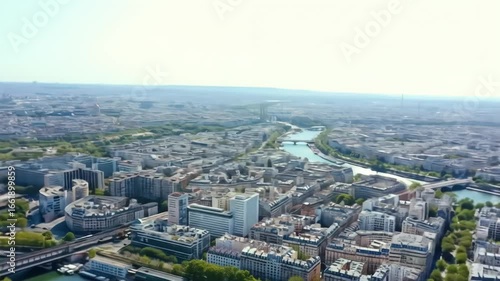High-angle, slightly blurred view of Paris, France, with the Eiffel Tower and Seine River