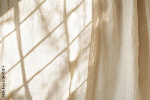 Sunlight on Beige Fabric Creates Window Shadows with Simplicity Theme