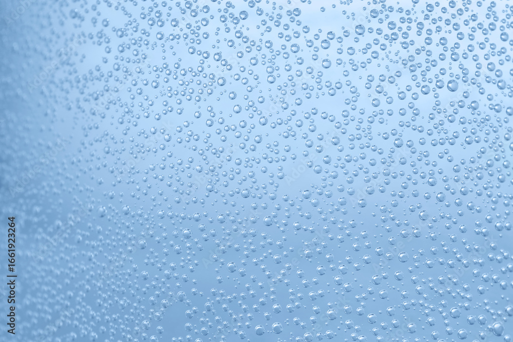 Soda water with bubbles of gas in glass, closeup Soda water with bubbles of gas in glass, closeup